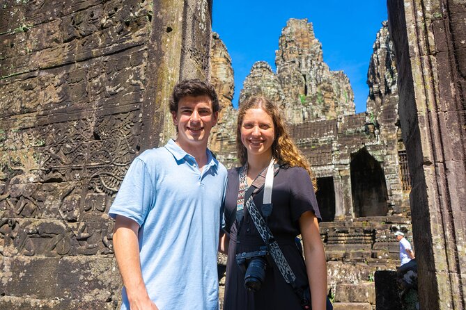 Angkor Sunrise Vespa Tour / Tuk Tuk or Car - Ta Prohm and the trees over stone