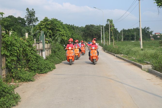 Hanoi Vespa Full Day City & Countryside with Female Ao Dai Riders - Railway life along Duong Tau