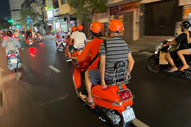 Saigon Vespa By Night Street Food With Female Riders Ao Dai - Seafood and local drinks begin the food trail