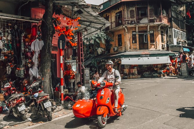 Vespa Sidecar Sightseeing and Cuisine Tour in Hanoi - Markets and the changing reality of train street