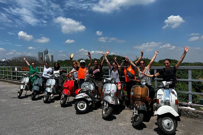 Vespa Tour HANOI BACK STREETS: FOOD+LOCAL LIFE+CULTURE & FUN - The mosaic wall, West Lake, and B52 Lake
